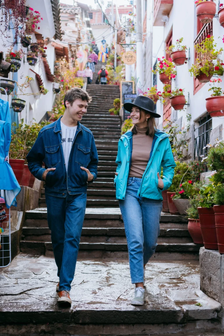 Stylish friends walking through the artisan streets of central Cusco, street's 7 borreguitos.